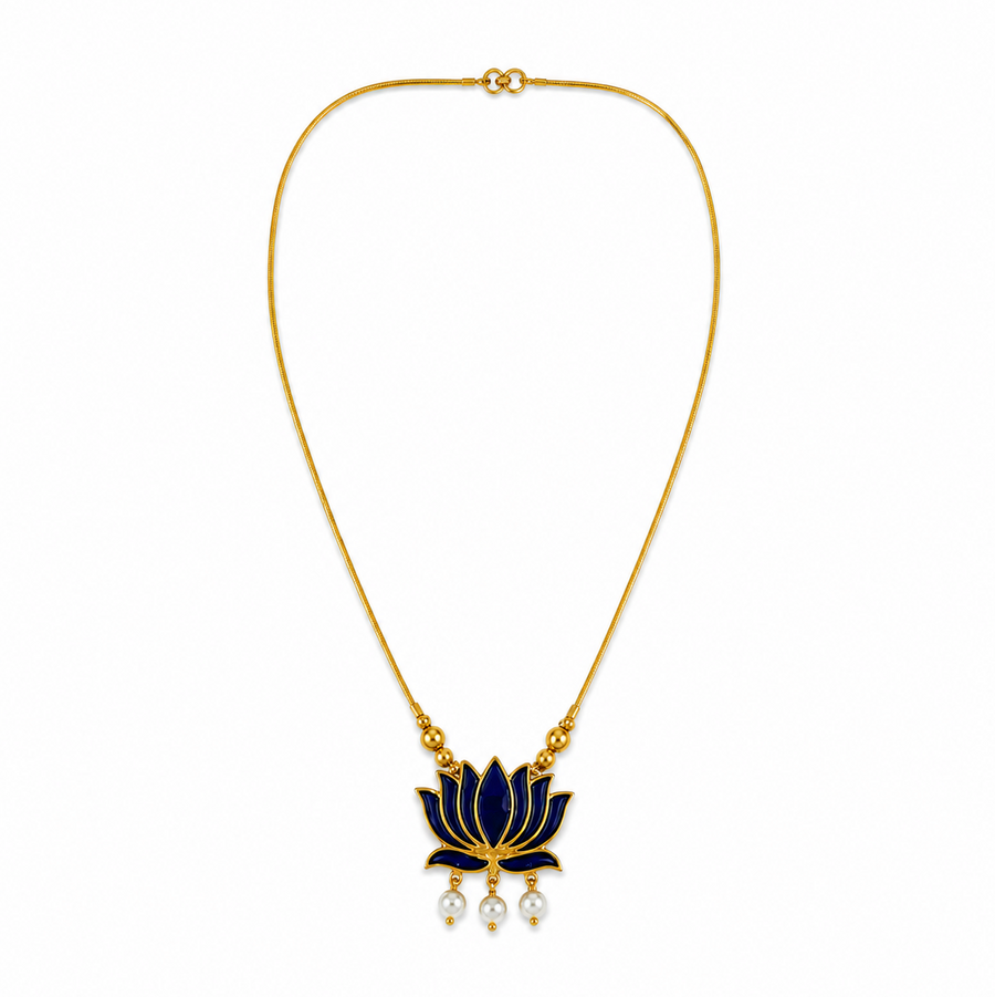 A delicate gold-plated chain necklace featuring a dark blue enamel lotus flower pendant with three dangling mini pearls at the bottom, centered on a solid white background. Available in the UK at theindianshelf.co.uk.