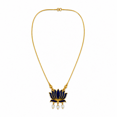 A delicate gold-plated chain necklace featuring a dark blue enamel lotus flower pendant with three dangling mini pearls at the bottom, centered on a solid white background. Available in the UK at theindianshelf.co.uk.