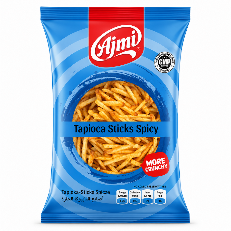 A professional studio shot of the Ajmi Tapioca Sticks Spicy packaging as seen in image_d4bcd7.jpg. The bag features a vibrant blue design with concentric circular patterns. A central circular window reveals the thin, golden-orange spicy tapioca sticks inside. The red "Ajmi" logo is centered at the top, and a red "MORE CRUNCHY" seal is featured on the lower right. This product is available in the UK at theindianshelf.co.uk.