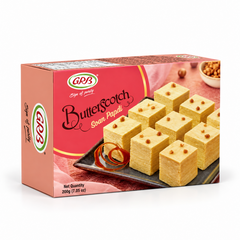 A 200g retail box of GRB Butterscotch Soan Papdi featuring brand logos and an arrangement of sweet cubes, centered on a solid white background. Available in the UK at theindianshelf.co.uk