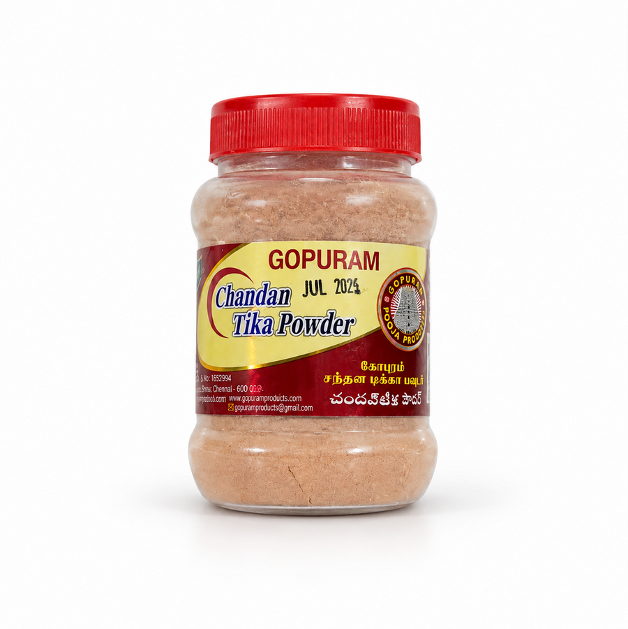 A clear plastic jar with a red lid containing Gopuram Chandan Tika Powder, centered on a solid white background. Available in the UK at theindianshelf.co.uk.