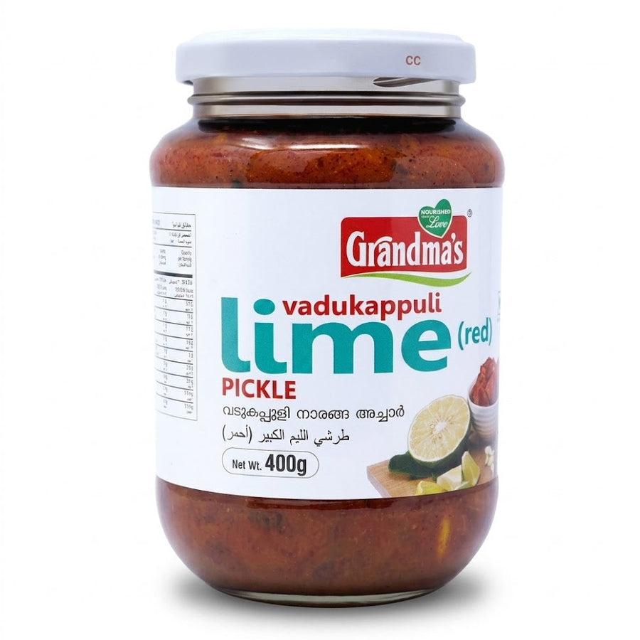 Grandma's Vadukappuli Lime Pickle (Red)
Experience the authentic, bold flavors of Kerala with Grandma's Vadukappuli Lime Pickle. This 400g jar features the unique Vadukappuli Naranga (Wild Lemon), known for its distinct aroma and larger size, preserved in a vibrant, spicy red gravy.Available in the UK at theindianshelf.co.uk.