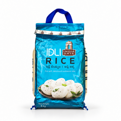 A 5 kg blue retail bag of India Gate Idli Rice featuring product branding, a carrying handle, and a visual of soft steamed idlis, centered on a solid white background. Available in the UK at theindianshelf.co.uk.
