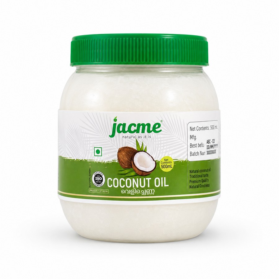 A professional studio shot of a 500 mL translucent wide-mouth plastic jar of Jacme Coconut Oil. The jar contains solidified white coconut oil and is sealed with a prominent green ribbed screw-on lid. The central white label features the green "jacme" logo with its tagline "natural as it is" against a faint palm frond pattern background. Below the logo a graphic showcases a whole brown coconut next to a split open coconut half with fresh white flesh.This product is available in the UK at theindianshelf.co.uk