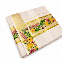 A studio product shot showing an angled view of an elegantly unfolded Kerala Set Saree on a plain white background. The off-white woven cotton fabric is layered to display both its decorative body border and its ornate corner panel layout. Broad shimmering golden tissue bands (kasavu) frame horizontal and vertical panels intricately embroidered with vivid yellow, pink, and orange flowers mixed with rich green leaves. Available in the UK at theindianshelf.co.uk.