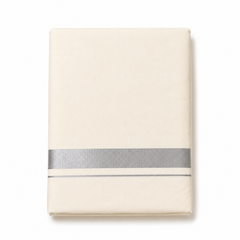 A neatly folded cream men's Kerala kasavu mundu (dhoti) centered on a solid white background, featuring a wide horizontal silver zari border (kara) and a thin parallel silver accent stripe near the bottom edge. Available in the UK at theindianshelf.co.uk.