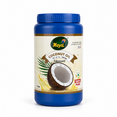A 1-liter blue jar of Mayil 100% Pure Coconut Oil centered on a solid white background, featuring a cream label with a graphic of a halved coconut and palm leaves. This product is available in the UK at theindianshelf.co.uk.