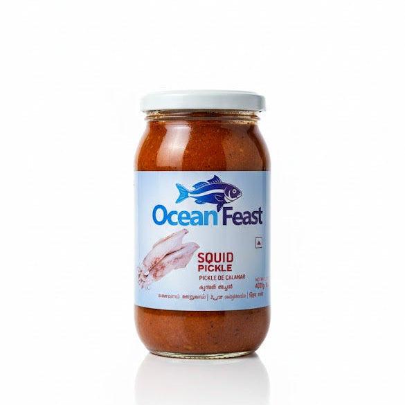 Ocean Feast Squid Pickle 400g glass jar, offering an authentic and savory seafood accompaniment for traditional meals, is available for purchase at theindianshelf.co.uk.