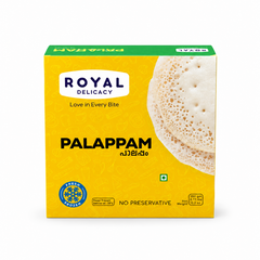 A professional studio product shot of a square yellow cardboard box for Royal Delicacy Frozen Palappam against a solid white background. The top features a green header strip, while the front face has a bright yellow background decorated with faint white line illustrations of breakfast foods and utensils.This product is available in the UK at theindianshelf.co.uk.