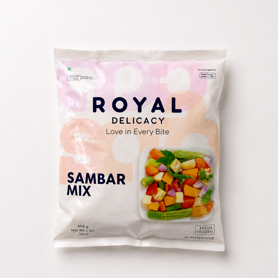 A studio product shot of a 454g white pouch of Royal Delicacy Sambar Mix against a white backdrop. The pack displays a bowl of chopped colorful vegetables like drumsticks, carrots, and pumpkin. Available in the UK at theindianshelf.co.uk.