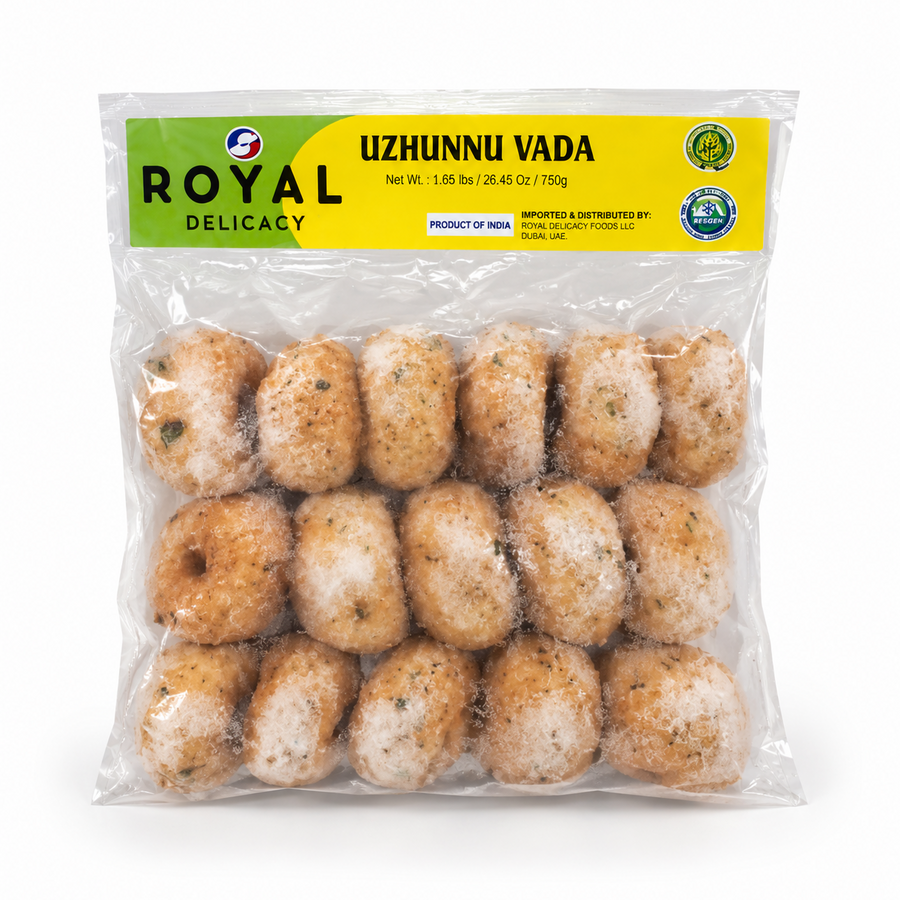 A transparent 750g bag of Royal Delicacy frozen Uzhunnu Vada featuring a yellow and green header label, centered on a solid white background. Available in the UK at theindianshelf.co.uk.