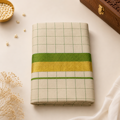 A neatly folded Kerala Gold Tissue Set Saree featuring a golden-beige body with subtle green checked patterns and a traditional green border accented with golden zari detailing. Styled in an elegant flatlay presentation with decorative accessories. This product is available in the UK at theindianshelf.co.uk.