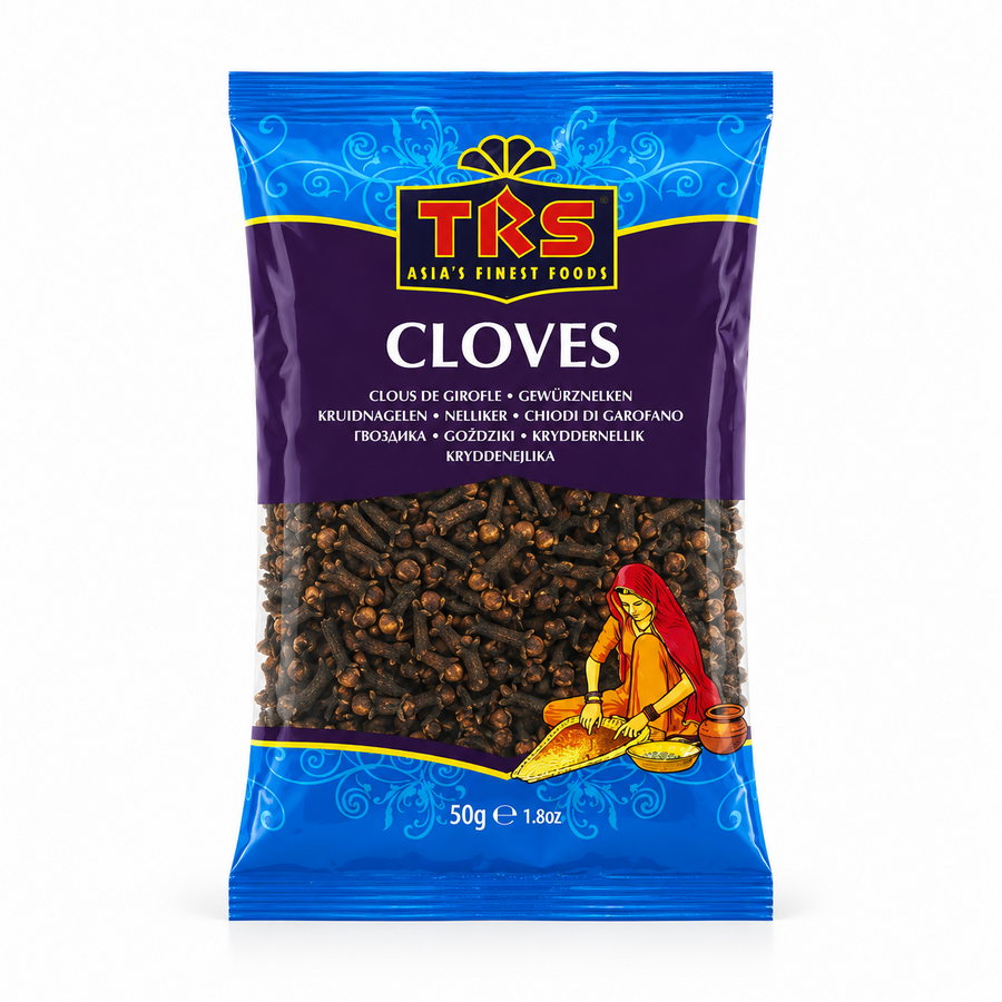 A 50g pouch of TRS Cloves centered on a solid white background, featuring a blue and deep purple ornate packaging design with the brand logo and a clear window displaying whole dried clove buds next to an illustration of a traditional Indian woman. This product is available in the UK at theindianshelf.co.uk.