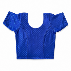 A royal blue short-sleeved stretchable readymade saree blouse with a textured jacquard micro-pattern and deep scoop neckline, laid flat against a solid white background. Available in the UK at theindianshelf.co.uk.