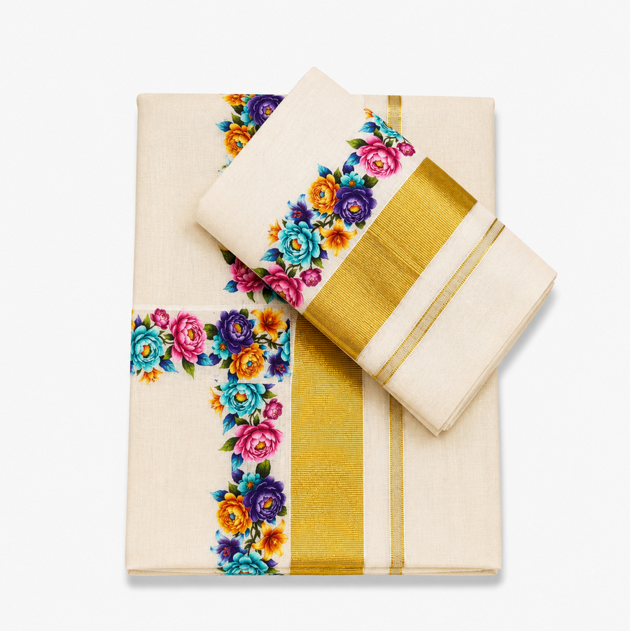 A neatly folded off-white Kerala cotton double set mundu with its matching neryathum folded diagonally on top against a solid white background, featuring a wide metallic gold zari band alongside a vibrant floral print border in pink, purple, turquoise, and yellow. Available in the UK at theindianshelf.co.uk
