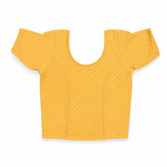 A vibrant yellow short-sleeved stretchable readymade saree blouse with a textured jacquard micro-pattern and deep scoop neckline, laid flat against a solid white background. Available in the UK at theindianshelf.co.uk.