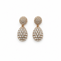 A pair of gold-tone two-tier drop earrings fully encrusted with clear pavé crystals against a solid white background. Available in the UK at indianshelf.co.uk.