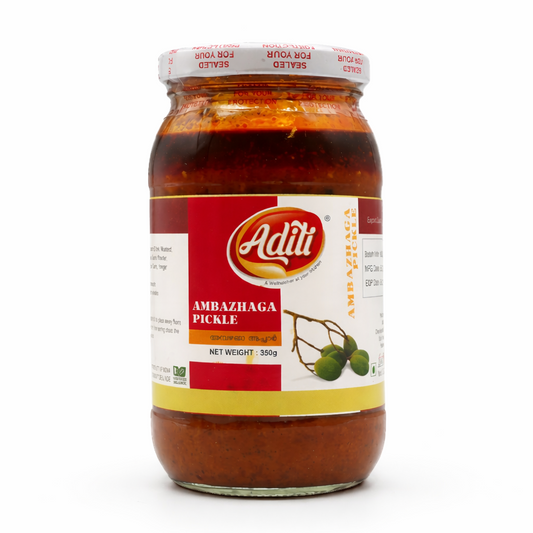 Aditi Ambazhaga Pickle (350g)
Discover the unique, tangy zest of Aditi Ambazhaga Pickle, made from Hog Plums (Ambazham). This traditional South Indian pickle delivers a sharp, sour punch balanced with a robust blend of aromatic spices and oilAll these products are available in the UK at theindianshelf.co.uk.