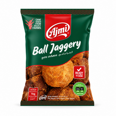 A dark green and red 1kg pouch of Ajmi Ball Jaggery showing a prominent graphic of traditional golden-brown round jaggery balls, centered against a solid white background. Available in the UK at indianshelf.co.uk.