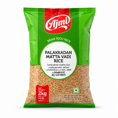 A 2kg green and red pouch of Ajmi Bran Rich Palakkadan Matta Vadi Rice showing the raw long grain red rice through a clear lower window, centered against a solid white background. Available in the UK at theindianshelf.co.uk.