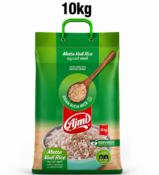 A professional studio product shot of a 10kg green rectangular rice sack with a built-in green plastic carrying handle, standing vertically against a solid white background under a bold "10kg" floating text label. The front face of the packaging features a multi-shaded green design. At the top, the product name "Matta Vadi Rice" is written in elegant script along with its Malayalam translation. This product is available in the UK at theindianshelf.co.uk.