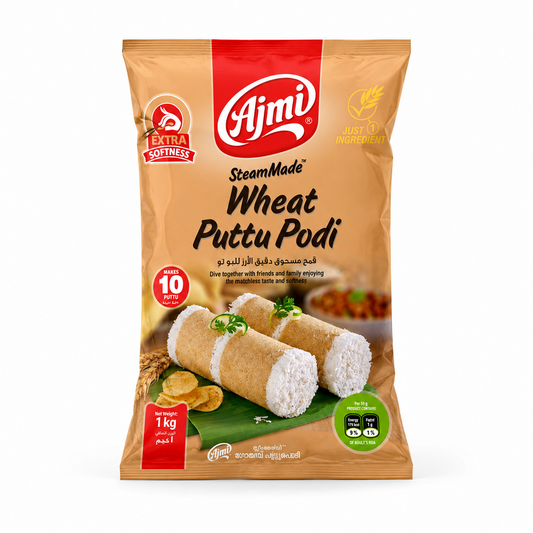 A 1 kg brown and red package of Ajmi SteamMade Wheat Puttu Podi showing an illustration of prepared steamed wheat puttu on a banana leaf, centered against a solid white background. Available in the UK at indianshelf.co.uk.