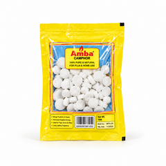 A yellow retail pouch of Amba Camphor Tablets containing 70 white tablets, centered on a solid white background. Available in the UK at theindianshelf.co.uk.