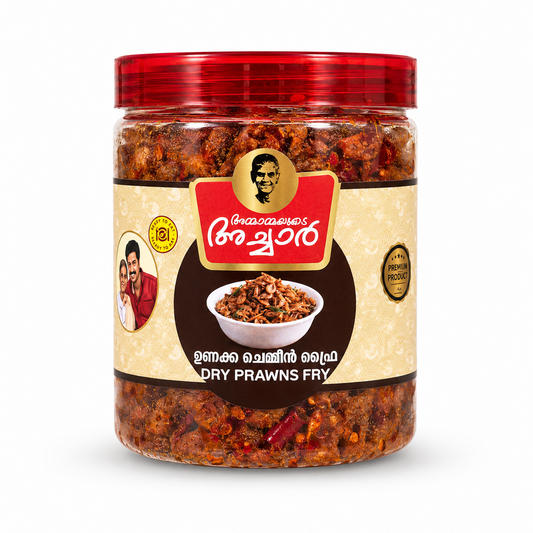 A professional studio shot of a transparent plastic jar of Ammayammayude Achar Dry Prawns Fry.The jar reveals a rich, dark-red and orange spiced dried prawns mix inside and is topped with a glossy, translucent red ribbed lid. The central label features a light cream-colored textured background with a dark circular section in the middle showcasing a white bowl filled with fried prawns. Above the circle, This product is available in the UK at theindianshelf.co.uk.