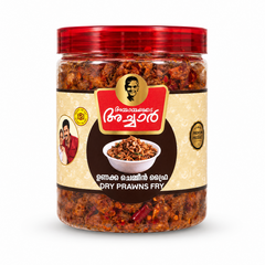 A professional studio shot of a transparent plastic jar of Ammayammayude Achar Dry Prawns Fry.The jar reveals a rich, dark-red and orange spiced dried prawns mix inside and is topped with a glossy, translucent red ribbed lid. The central label features a light cream-colored textured background with a dark circular section in the middle showcasing a white bowl filled with fried prawns. Above the circle, This product is available in the UK at theindianshelf.co.uk.