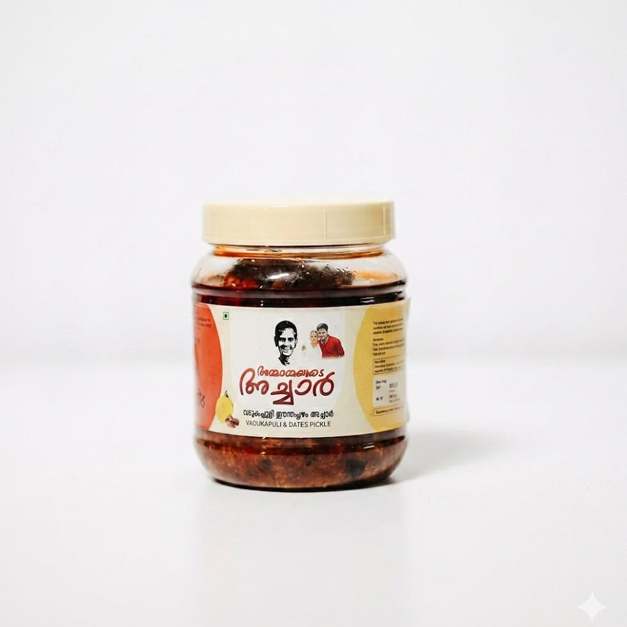 Ammayimarude Vadukapuli & Dates Pickle
Indulge in a unique fusion of flavors with Ammayimarude Vadukapuli & Dates Pickle. This specialty pickle combines the bold, citrusy tang of Vadukapuli Naranga (Wild Lemon) with the natural, jammy sweetness of dates, creating a perfectly balanced sweet-and-sour profile.Available in the UK at theindianshelf.co.uk.