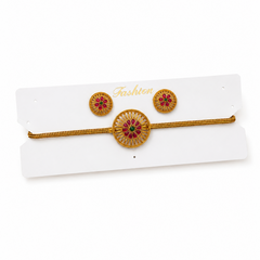 A studio product shot of an antique gold-plated Jewelry Set displayed on a white card against a pure white background in image_272b7b_2.jpg. The set consists of a braided chain choker or bajuband and matching round stud earrings, each detailed with a red and green stone floral wheel motif. Available in the UK at theindianshelf.co.uk.