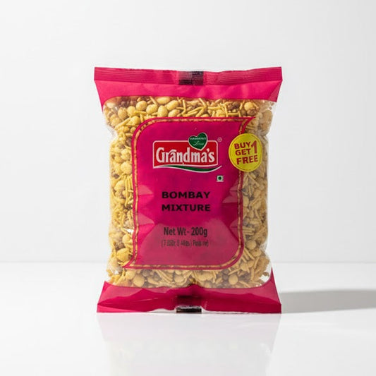 The image shows a 200g pack of Grandma's Bombay Mixture, a savory snack featuring a buy one get one free offer, available from theindianshelf.co.uk.