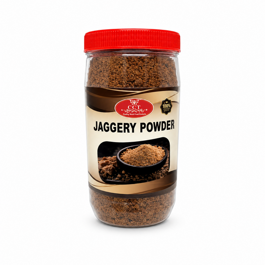 A transparent plastic jar with a red lid filled with rich brown CCT Jaggery Powder, featuring a cream and brown label with a graphic of a small bowl of jaggery, centered against a solid white background.