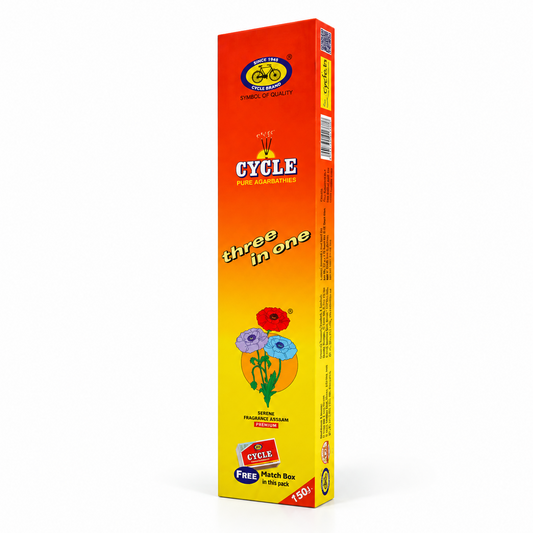 A box of Cycle Brand Three in One Pure Agarbathies in vibrant orange and yellow packaging, centered on a solid white background. Available in the UK at theindianshelf.co.uk.