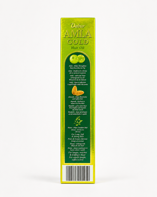A professional studio shot showcasing the narrow side panel of the rectangular cardboard box for Dabur Amla Gold Hair Oil The box features a reflective, metallic golden-green background framing a long, dark green central panel with an arched top.This product is available in the UK at theindianshelf.co.uk.