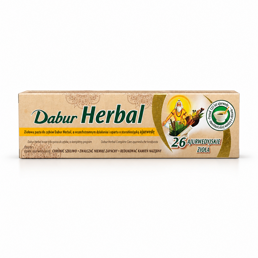 A box of Dabur Herbal Complete Care Ayurvedic Toothpaste centered on a solid white background, featuring a natural beige and green box with an illustration of an Ayurvedic sage alongside herbs in a mortar and pestle, highlighted with text reading "26 Ajurwedyjskie Zioła". This product is available in the UK at theindianshelf.co.uk.