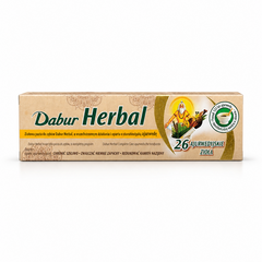 A box of Dabur Herbal Complete Care Ayurvedic Toothpaste centered on a solid white background, featuring a natural beige and green box with an illustration of an Ayurvedic sage alongside herbs in a mortar and pestle, highlighted with text reading "26 Ajurwedyjskie Zioła". This product is available in the UK at theindianshelf.co.uk.