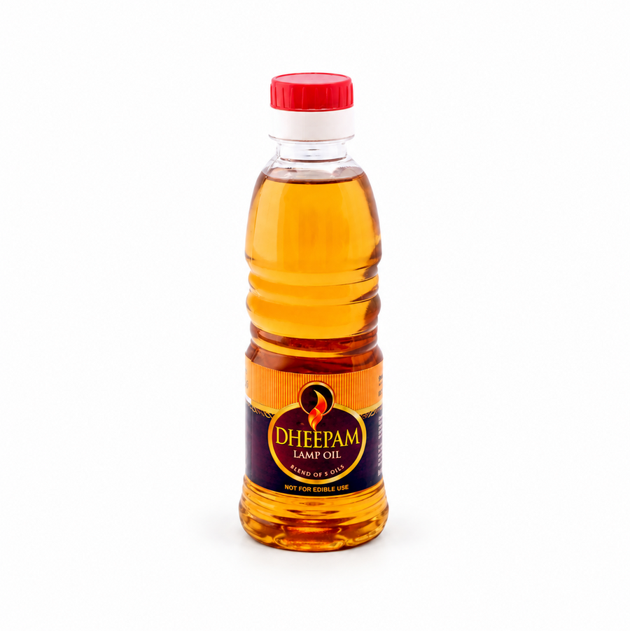 A bottle of Dheepam Lamp Oil blend of 5 oils with a red cap, centered on a solid white background. Available in the UK at theindianshelf.co.uk.