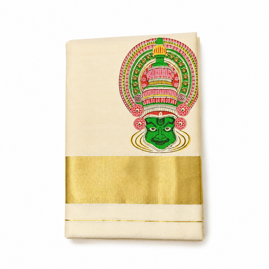 A studio product shot of a neatly folded, traditional off-white Kerala Kasavu Saree with a wide golden zari border isolated on a white background. The saree features a prominent, colorful hand-painted Kathakali dance face motif. Available in the UK at theindianshelf.co.uk.