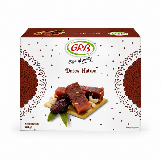 A professional studio product shot of a square white cardboard outer carton for GRB Dates Halwa against a solid white background. The box features a delicate, all-over pattern of small brown dots, framed on the left and right edges by large, decorative brown mandala semi-circles. At the top center sits the oval green and red "GRB" logo above the script text "Sign of purity" and the brown title "Dates Halwa". This product is available in the UK at theindianshelf.co.uk.