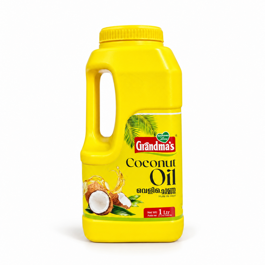 A 1-litre yellow jug of Grandma's Pure Coconut Oil featuring a handle, palm frond graphics, and fresh coconut imagery against a clean white background. Available in the UK at theindianshelf.co.uk.