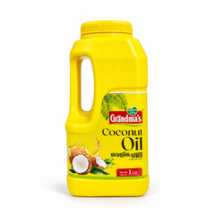 A 1-litre yellow jug of Grandma's Pure Coconut Oil featuring a handle, palm frond graphics, and fresh coconut imagery against a clean white background. Available in the UK at theindianshelf.co.uk.