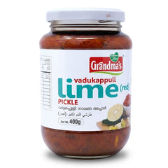 Grandma's Vadukappuli Lime Pickle (Red)
Experience the authentic, bold flavors of Kerala with Grandma's Vadukappuli Lime Pickle. This 400g jar features the unique Vadukappuli Naranga (Wild Lemon), known for its distinct aroma and larger size, preserved in a vibrant, spicy red gravy.Available in the UK at theindianshelf.co.uk.