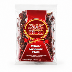 A 50g transparent pouch of Heera Whole Kashmiri Chilli centered on a solid white background, featuring a bold red label with a central golden eagle logo design displaying the dried red chillies through the clear packaging. This product is available in the UK at theindianshelf.co.uk.