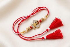 Designer Om & Trishul Gold-Plated Rakhi with Red & White Thread