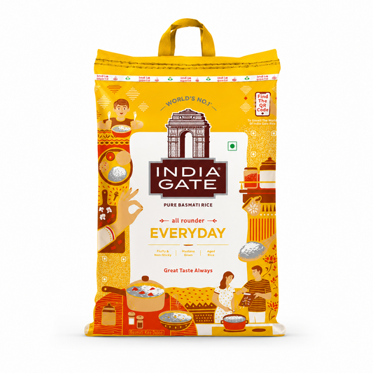 A professional studio product shot of a vertically oriented, bright yellow woven fabric bag of India Gate Everyday Basmati Rice featuring a top carrying handle against a solid white background. The center layout displays a prominent white shield housing a brown illustration of the historic India Gate monument above the bold white brand text "INDIA GATE" on a dark brown rectangular block. This product is available in the UK at theindianshelf.co.uk.
