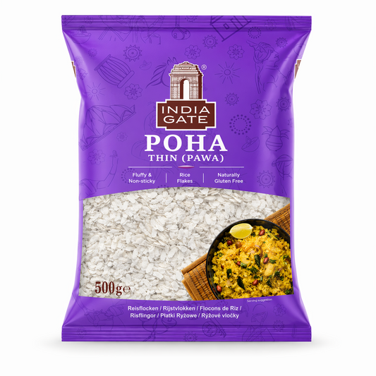 A professional studio shot of a 500g bag of India Gate Thin Poha (Pawa). The packaging is a vibrant purple featuring traditional Indian motifs and the iconic white "India Gate" monument logo. A transparent window in the center displays the thin, white rice flakes inside. To the bottom right, a serving suggestion shows a bowl of bright yellow prepared Poha garnished with peanuts and lime. Key features "This product is available in the UK at theindianshelf.co.uk.