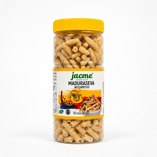A professional studio shot of a tall, transparent plastic jar filled with Jacme Maduraseva (Sweet Sev) The clear jar showcases countless golden-brown, thick, sugarcane-like textured strands of sugar-coated sev packed tightly inside, topped with a bright yellow ribbed plastic screw-on cap. The wrap-around label features a clean white background bordered by thick, vibrant yellow bands at the top and bottom. This product is available in the UK at theindianshelf.co.uk.