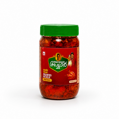 A studio product shot of a transparent glass jar filled with rich red Kerala Prawns Pickle against a plain white background. The jar features a bright green ribbed screw cap and a dark red label depicting a cooked prawn illustration and an ethnic family portrait logo. The text reads "PRAWNS PICKLE" and "Ready to Eat". Available in the UK at theindianshelf.co.uk.