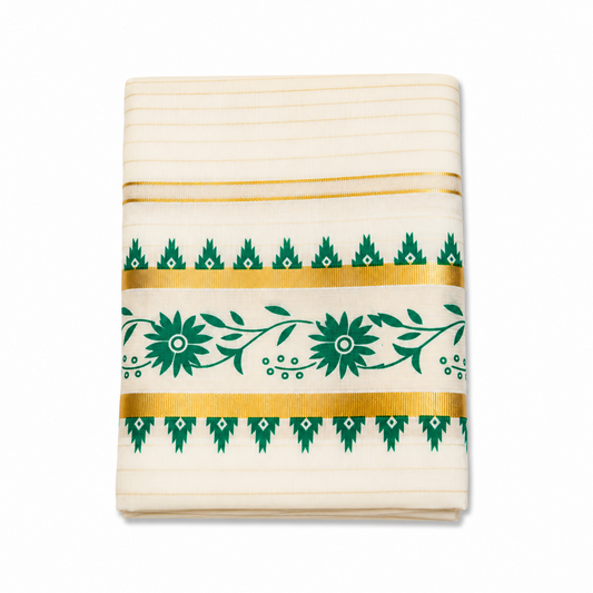 A close-up folded view of an off-white Kerala tissue cotton kasavu set mundu centered on a solid white background, showcasing a horizontal green floral vine motif framed by gold zari bands and green temple edge borders. Available in the UK at theindianshelf.co.uk.